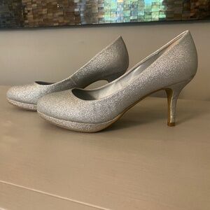Beautiful silver, metallic, high, heeled shoes, women’s size 8.